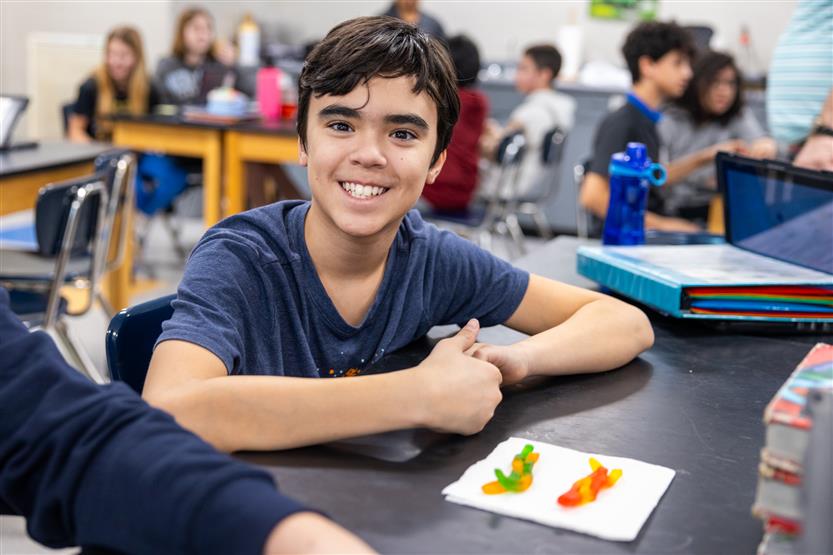 Middle school students in science class